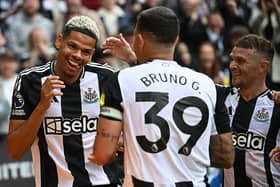 Newcastle United's Danish striker William Osula celebrates scoring the team's third goal with Brazilian midfielder Bruno Guimaraes (C) and defender Kieran Trippier during the English Premier League football match between Newcastle United and Ipswich Town at St James' Park.