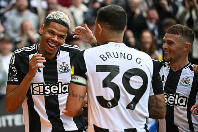 Newcastle United's Danish striker William Osula celebrates scoring the team's third goal with Brazilian midfielder Bruno Guimaraes (C) and defender Kieran Trippier during the English Premier League football match between Newcastle United and Ipswich Town at St James' Park.