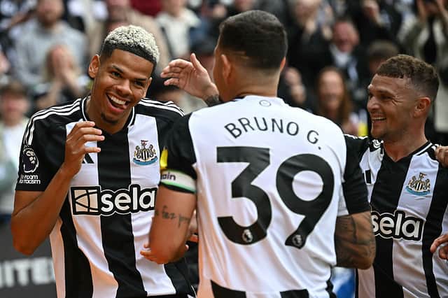 Newcastle United's Danish striker William Osula celebrates scoring the team's third goal with Brazilian midfielder Bruno Guimaraes (C) and defender Kieran Trippier during the English Premier League football match between Newcastle United and Ipswich Town at St James' Park.