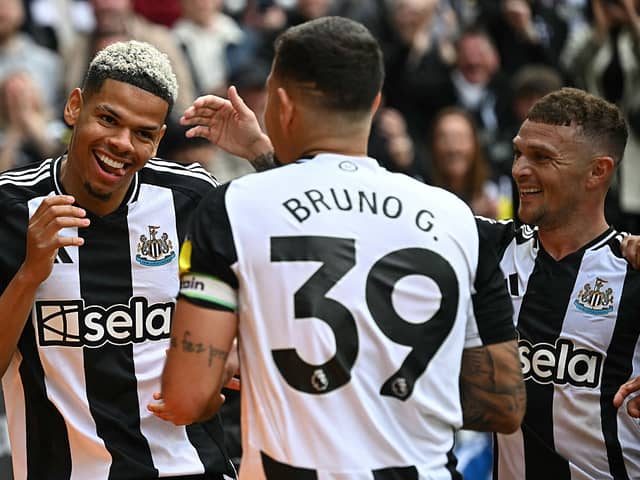 Newcastle United's Danish striker William Osula celebrates scoring the team's third goal with Brazilian midfielder Bruno Guimaraes (C) and defender Kieran Trippier during the English Premier League football match between Newcastle United and Ipswich Town at St James' Park.