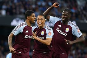 Marcus Rashford of Aston Villa celebrates scoring his team's first goal with Youri Tielemans and Amadou Onana during the Premier League match between Manchester City FC and Aston Villa FC at Etihad Stadium on April 22, 2025 in Manchester, England. (Photo by Carl Recine/Getty Images)
