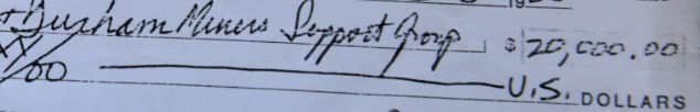 The cheque to the Durham Miners Support Group.