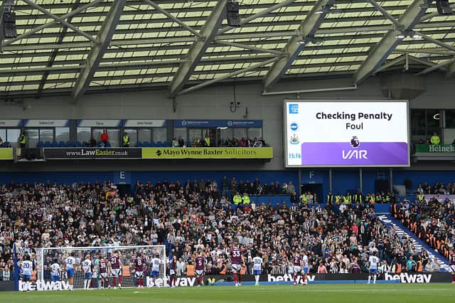 The LED board shows the Video Assistant Referee checking for possible penalty following a foul during the Premier League match between Brighton & Hove Albion FC and Newcastle United FC at Amex Stadium on May 04, 2025 in Brighton, England. (Photo by Mike Hewitt/Getty Images)