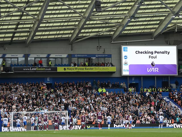 The LED board shows the Video Assistant Referee checking for possible penalty following a foul during the Premier League match between Brighton & Hove Albion FC and Newcastle United FC at Amex Stadium on May 04, 2025 in Brighton, England. (Photo by Mike Hewitt/Getty Images)