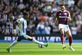 Pervis Estupinan of Brighton & Hove Albion blocks a cross from Jacob Murphy of Newcastle United during the Premier League match between Brighton & Hove Albion FC and Newcastle United FC at Amex Stadium on May 04, 2025 in Brighton, England. (Photo by Mike Hewitt/Getty Images)
