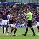 Newcastle United player react to referee Craig Pawson penalty decision prior to it being over-turned during the Premier League match between Brighton & Hove Albion FC and Newcastle United FC at Amex Stadium on May 04, 2025 in Brighton, England. (Photo by Charlie Crowhurst/Getty Images)
