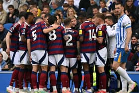 Newcastle United's English head coach Eddie Howe talks to his players. 
