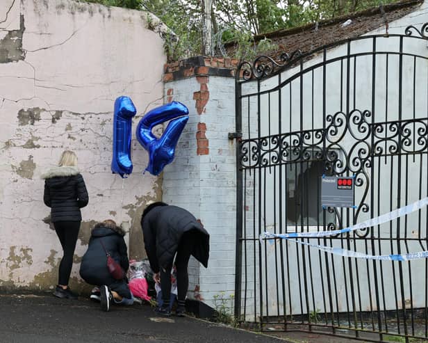 Well wishers leave floral tributes outside Fairfield Industrial Park in the Bill Quay area of Gateshead.