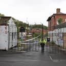 A police officer stands guard outside Fairfield Industrial Park in the Bill Quay area of Gateshead on Sunday morning, where the body of 14 year old Layton Carr was discovered inside a building after firefighters rushed to the scene shortly after 8pm on Friday night and extinguished a blaze. 