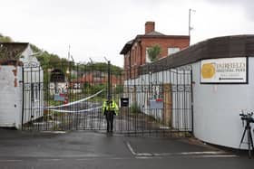 A police officer stands guard outside Fairfield Industrial Park in the Bill Quay area of Gateshead on Sunday morning, where the body of 14 year old Layton Carr was discovered inside a building after firefighters rushed to the scene shortly after 8pm on Friday night and extinguished a blaze. 