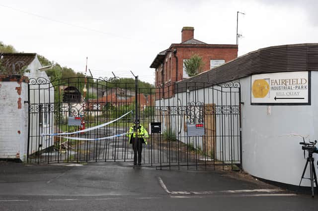 A police officer stands guard outside Fairfield Industrial Park in the Bill Quay area of Gateshead on Sunday morning, where the body of 14 year old Layton Carr was discovered inside a building after firefighters rushed to the scene shortly after 8pm on Friday night and extinguished a blaze.