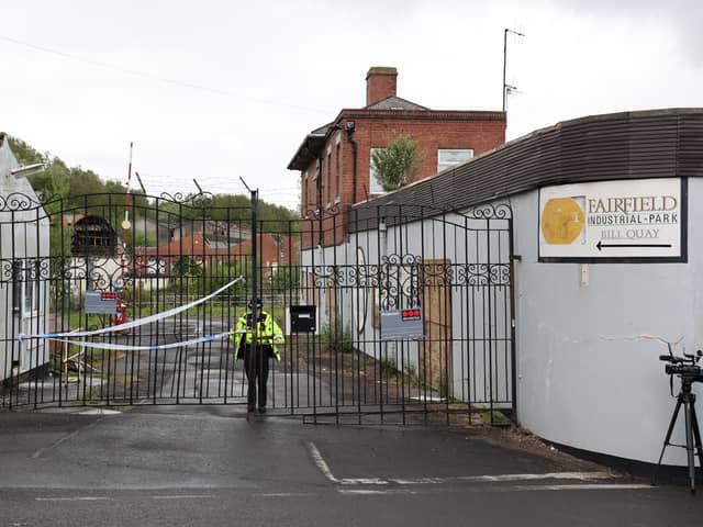 A police officer stands guard outside Fairfield Industrial Park in the Bill Quay area of Gateshead on Sunday morning, where the body of 14 year old Layton Carr was discovered inside a building after firefighters rushed to the scene shortly after 8pm on Friday night and extinguished a blaze. 