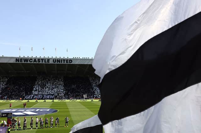 Newcastle United fans wave flags and show support as the teams line up prior to the Premier League match between Newcastle United FC and Chelsea FC at St James' Park on May 11, 2025 in Newcastle upon Tyne, England. (Photo by George Wood/Getty Images)