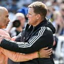 Chelsea's Italian head coach Enzo Maresca (L) and Newcastle United's English head coach Eddie Howe (R) hugh each other at the start of the English Premier League football match between Newcastle United and Chelsea at St James' Park in Newcastle-upon-Tyne, north east England on May 11, 2025. (Photo by ANDY BUCHANAN / AFP) /