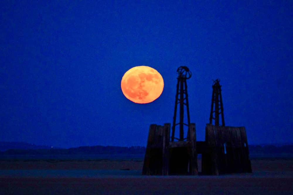 The Flower Moon appears in the sky over St Anne's on the Lancashire coastline.