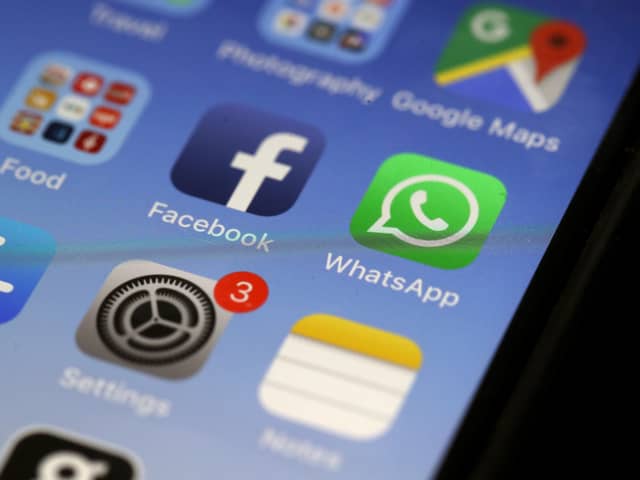 WhatsApp app on an older iPhone model