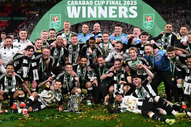 The Newcastle United squad and members of the coaching staff celebrate in a team picture after the Carabao Cup Final between Liverpool and Newcastle United at Wembley Stadium on March 16, 2025 in London, England. (Photo by Stu Forster/Getty Images)