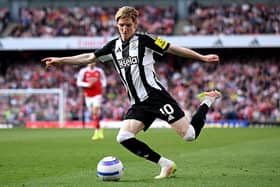 Anthony Gordon of Newcastle United crosses the ball during the Premier League match between Arsenal FC and Newcastle United FC at Emirates Stadium on May 18, 2025 in London, England.