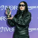 Charli XCX, winner of the Songwriter of the Year award, poses in the winners room at the Ivor Novello Awards 2025 at Grosvenor House on May 22, 2025 in London, England.