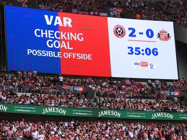 The LED screen displays a message from VAR which reads "Checking Goal, possible offside  during the Sky Bet Championship Play-Off Final match between Sheffield United and Sunderland at Wembley Stadium on May 24, 2025 in London, England. This weekend's EFL play-off matches at Wembley will all kick-off one minute late, to raise awareness for the âEvery Minute Mattersâ campaign, which aims to encourage people to learn CPR. (Photo by Mike Hewitt/Getty Images)