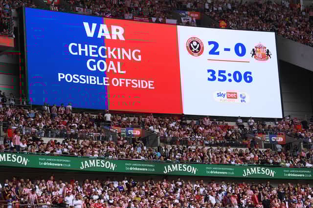 The LED screen displays a message from VAR which reads "Checking Goal, possible offside during the Sky Bet Championship Play-Off Final match between Sheffield United and Sunderland at Wembley Stadium on May 24, 2025 in London, England. (Photo by Mike Hewitt/Getty Images)