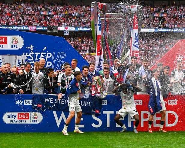 Sunderland players celebrate their promotion.