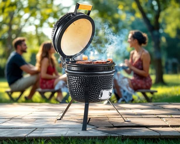 The Kamado-style ceramic BBQ in action – perfect for slow-smoked feasts and summer gatherings.