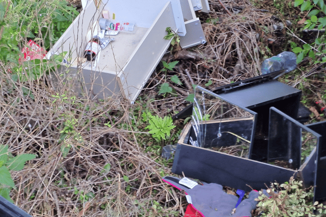 A serial fly tipper has kept her freedom despite being caught on camera three times.