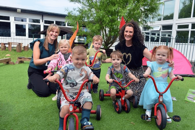 Nursery assistant Hayley Malpass and manager Emma Hartley celebrate Stanley's nursery at Whitburn and Marsden family hub Ofsted report with some of the youngsters.