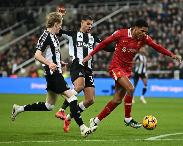 Jarrell Quansah and Anthony Gordon battle in the Premier League match between Liverpool and Newcastle | Getty Images