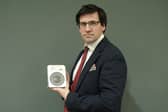 Anderson and Garland director Fred Wryley-Birch with the rare medal. 