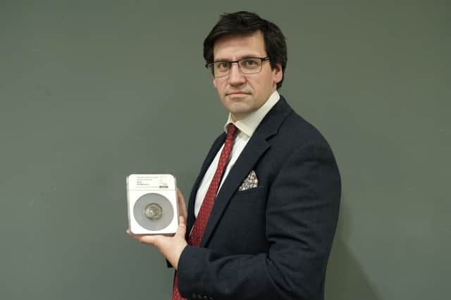 Anderson and Garland director Fred Wryley-Birch with the rare medal.