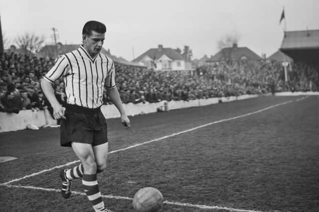 Stan Anderson on the ball in a match in Brighton, in December 1958. (Photo by Evening Standard/Hulton Archive/Getty Images)