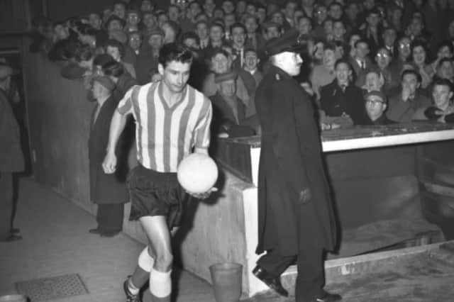 Stan Anderson runs out for a match in February 1961.