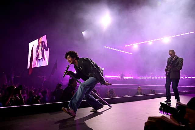 The 1975, fronted by Matty Healy perform on the Pyramid stage during the third day of the Glastonbury festival at Worthy Farm