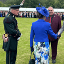 Wayne's dad, George Flood, shaking the hand of Princess Anne during a garden party at the Palace of Holyroodhouse.