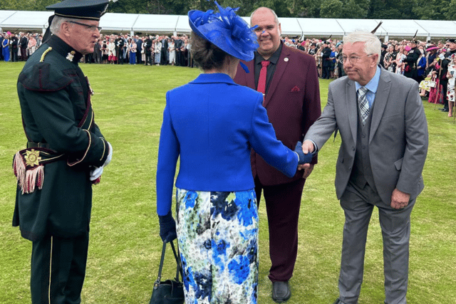 Wayne's dad, George Flood, shaking the hand of Princess Anne during a garden party at the Palace of Holyroodhouse.