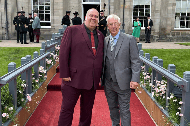 Wayne Groves (left) with his dad, George Flood, at the Palace of Holyroodhouse.
