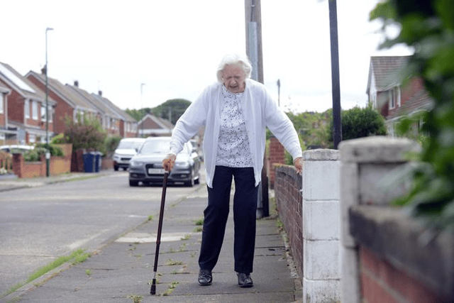 Windsor Drive resident Moira Irbton struggling with the poor quality of the pavements.