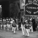 Boldon Melody Makers Juvenile Jazz Band passing under a bridge in 1959.