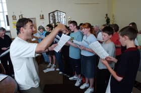 Tim Harrison was leading the way with this rousing choir session at Holy Rosary Church in Horsley Hill Square in August 2003.
Tell us if you were one of the singers in the picture.