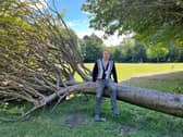 Local councillor Tom Woodwark with a fallen tree in Gosforth Central Park