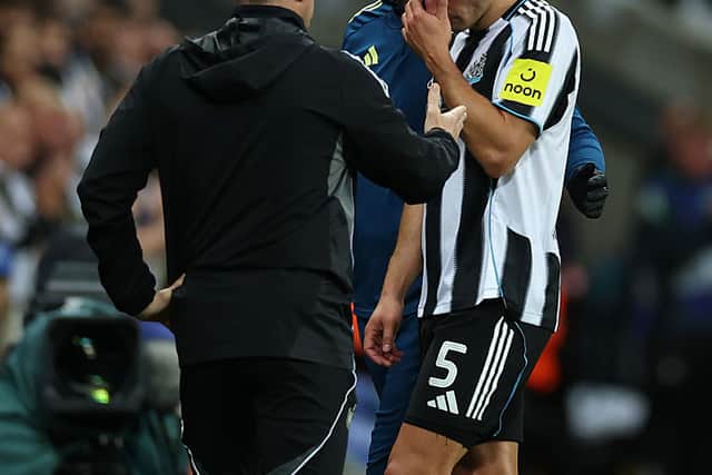 Fabian Schar of Newcastle United looks dejected as he is consoled by Eddie Howe, Manager of Newcastle United, after being substituted during the UEFA Champions League 2025/26 League Phase MD1 match between Newcastle United FC and FC Barcelona at St James' Park on September 18, 2025 in Newcastle upon Tyne, England. (Photo by Stu Forster/Getty Images)