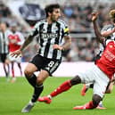 Bukayo Saka of Arsenal is tackled by Sandro Tonali and Anthony Gordon of Newcastle United during the Premier League match between Newcastle United and Arsenal at St James' Park on September 28, 2025 in Newcastle upon Tyne, England.