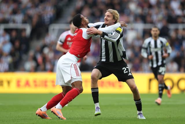 Gabriel of Arsenal tussles with Nick Woltemade of Newcastle United during the Premier League match between Newcastle United and Arsenal at St James' Park on September 28, 2025 in Newcastle upon Tyne, England.