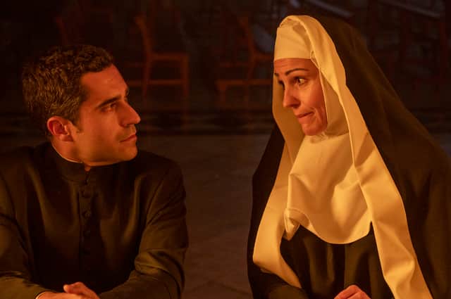 Father Gonzalez [Ede Ferras] and Bert [Suranne Jones] in Frauds
