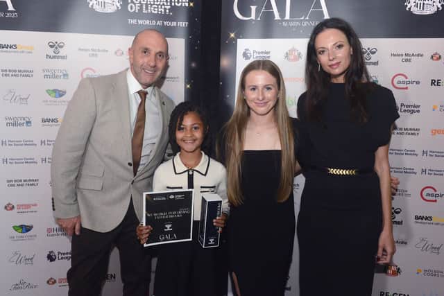 Esther Brooks, 9, with Neil Burke, Emily Cassap, and Regina Kane.