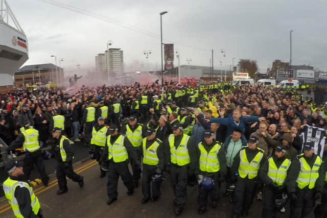 A strong police presence guards Newcastle United supporters as they arrive at the Stadium of Light to be met with a barrage of jeers from Sunderland supporters at the ground, ahead of the 2pm Premier League kick off this afternoon.