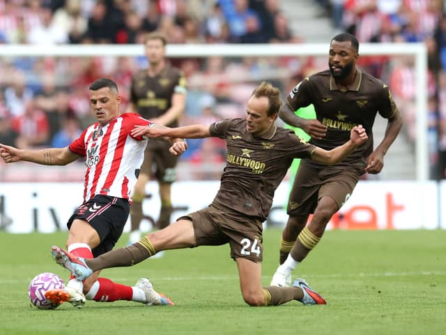Granit Xhaka of Sunderland battles.