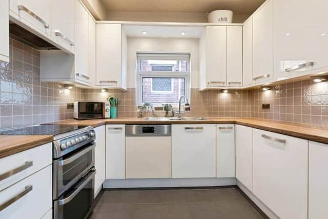Designed for everyday life, the kitchen is supported by a separate utility room that keeps things practical and clutter-free